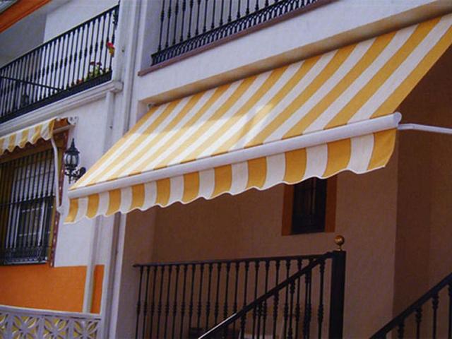 Toldo punto recto - portada - fachada